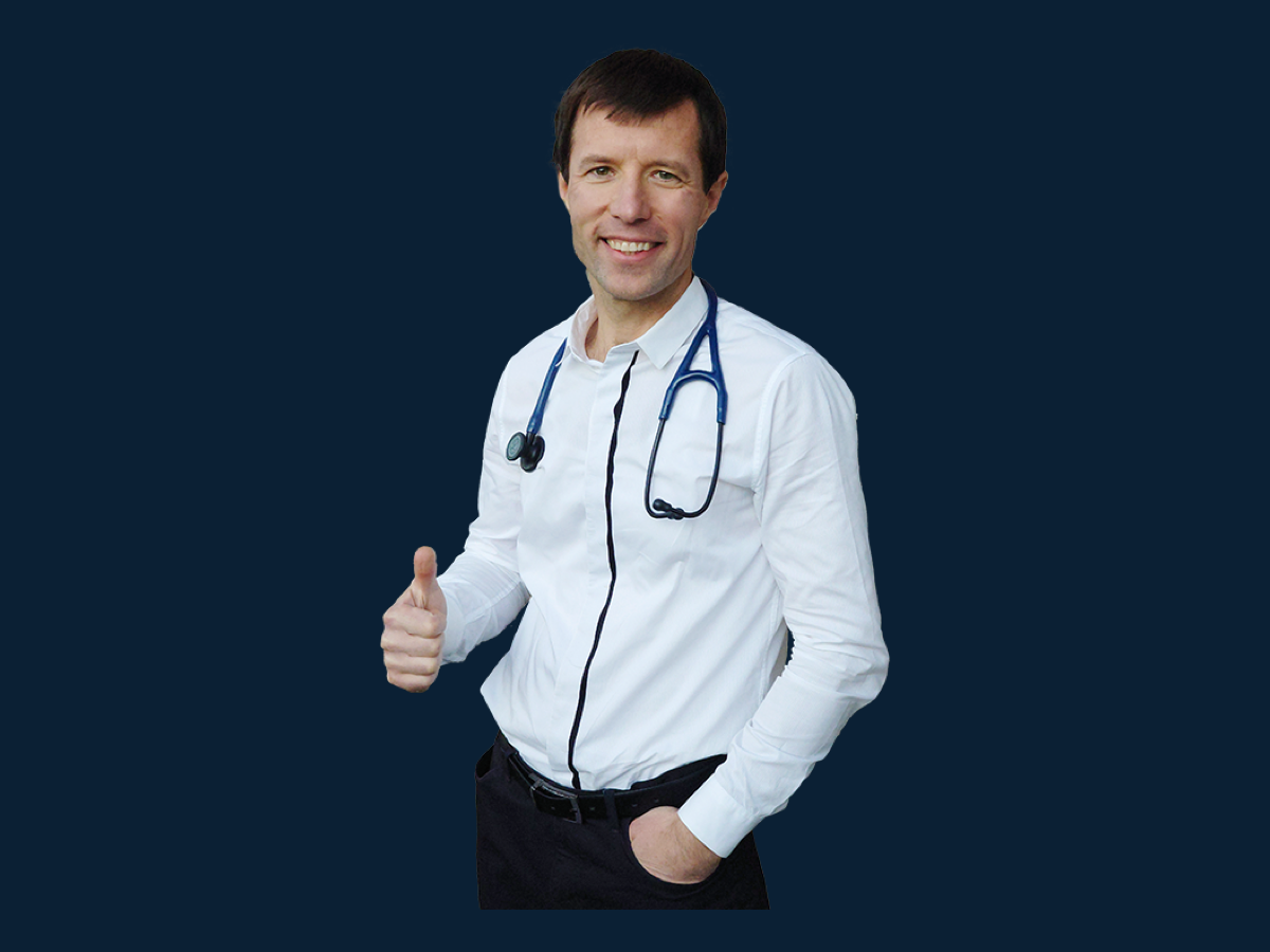 Dr. Paul Royal-Priest in medical attire